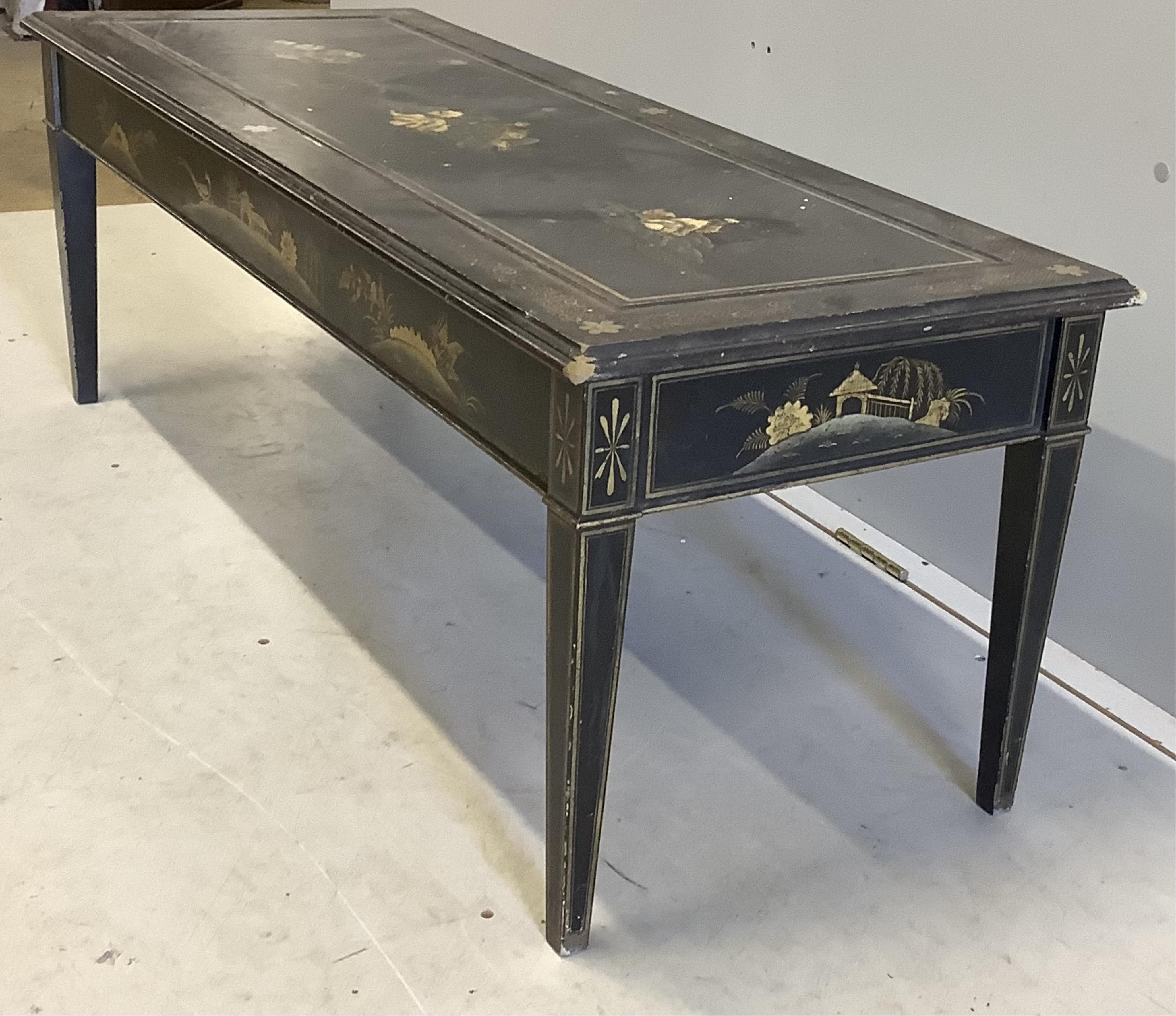 A rectangular black lacquered coffee table, width 120cm, depth 46cm, height 44cm. Condition - poor to fair